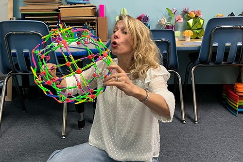 Speech therapist Heather Boerner integrating play into a therapy session, representing strengths-based, neurodiverse affirming speech therapy in NYC.