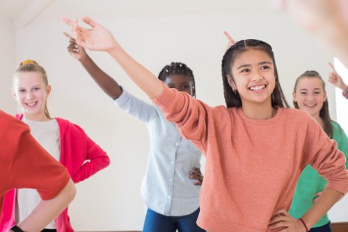 Group Of Children Enjoying Drama Class Together