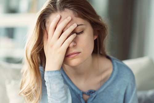 Young woman with headache